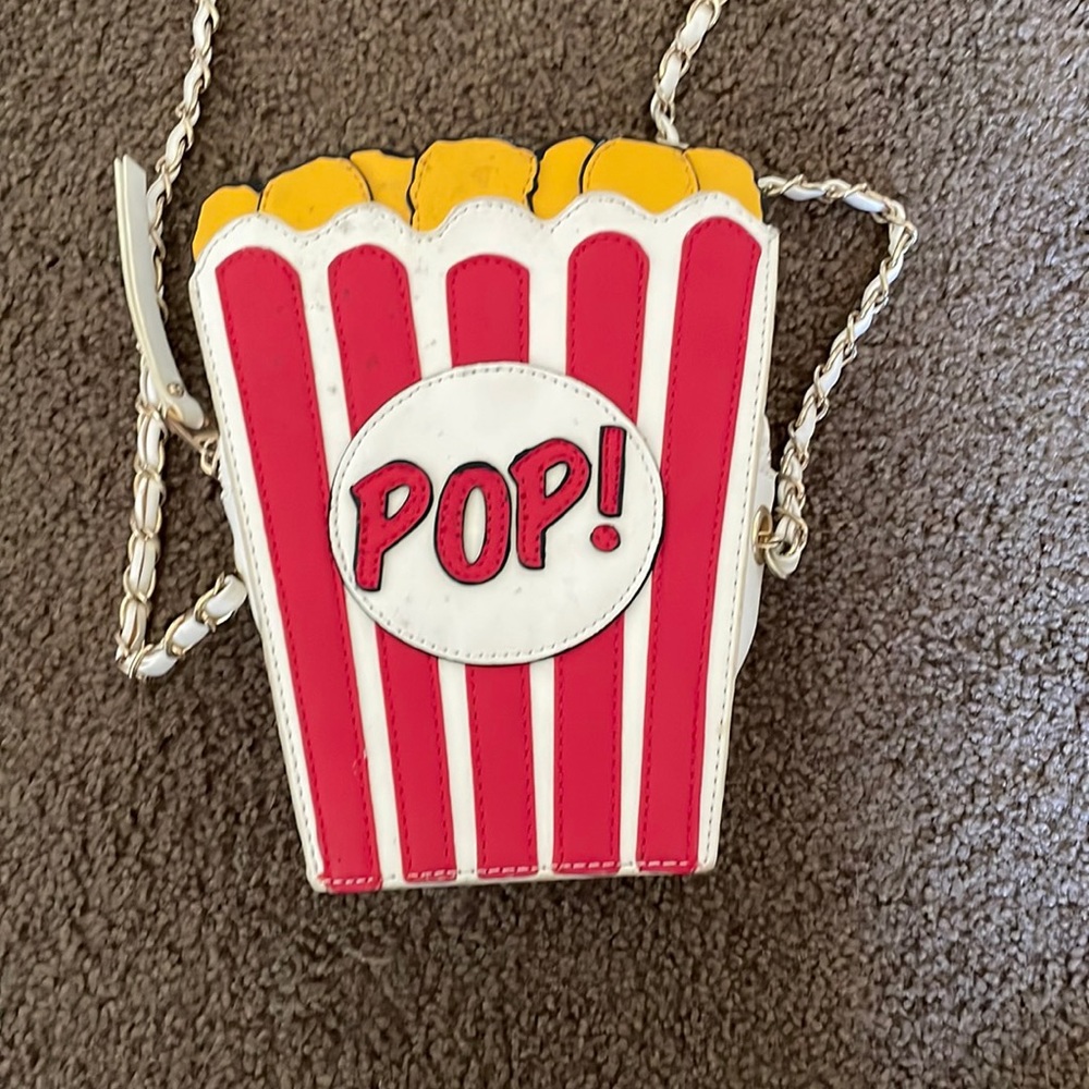 Purse medium color red white / yellow it’s in okay condition